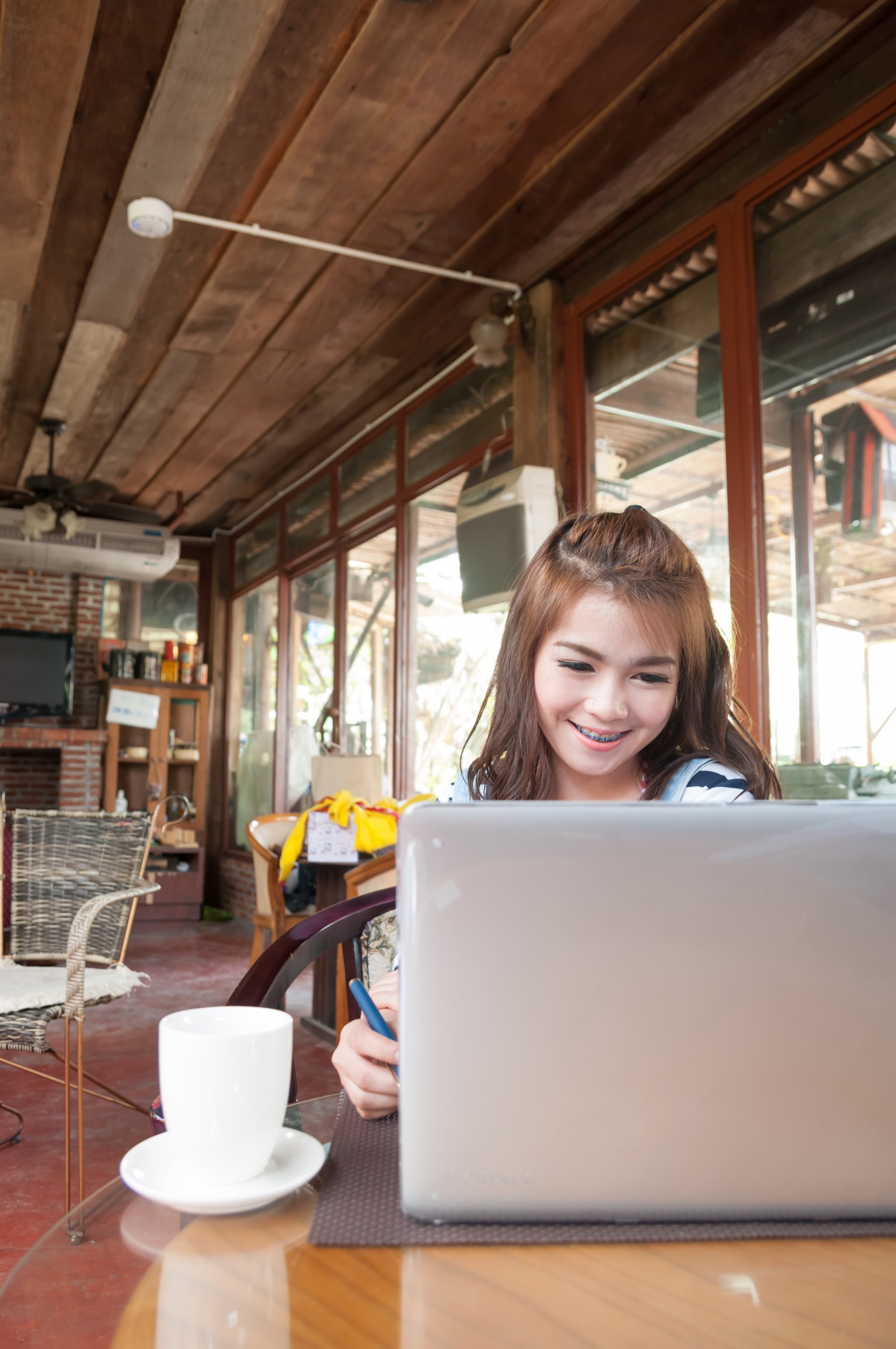 student working in a cafe