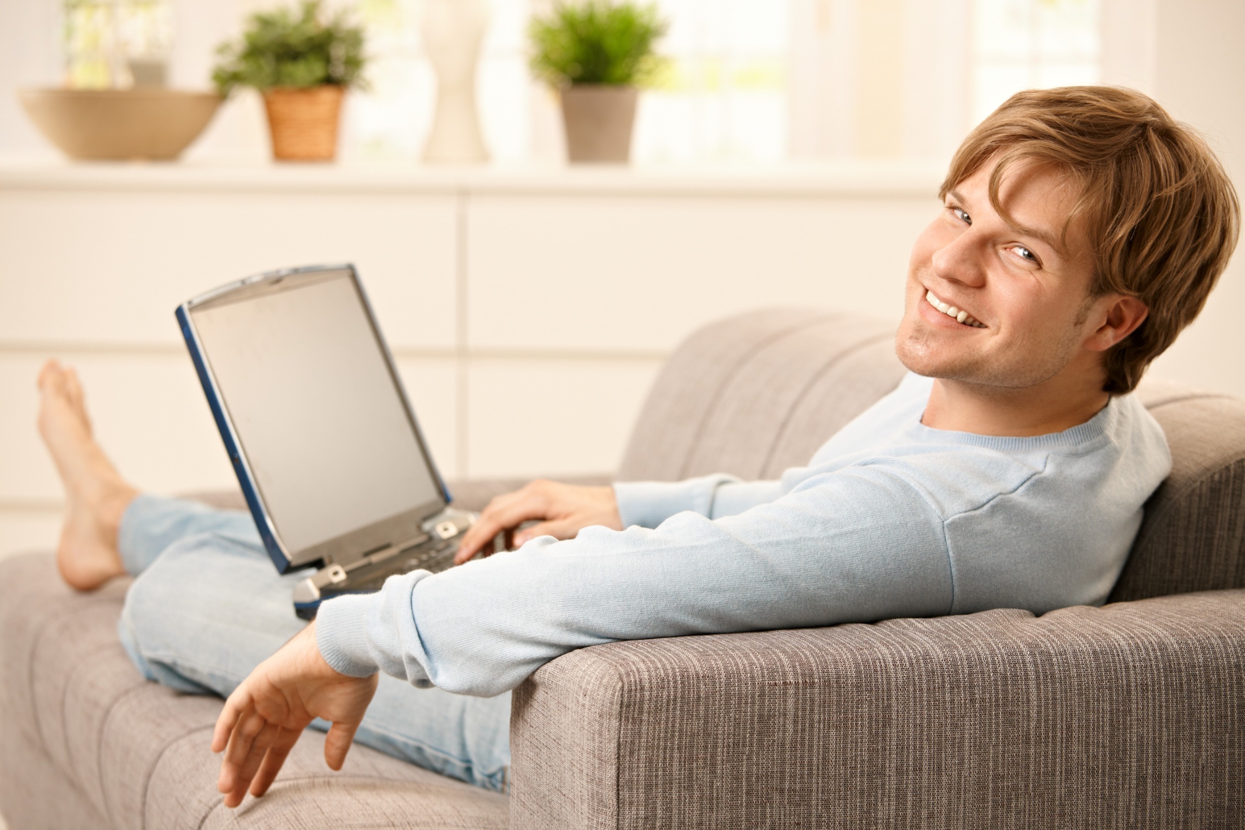 man working remotely happy