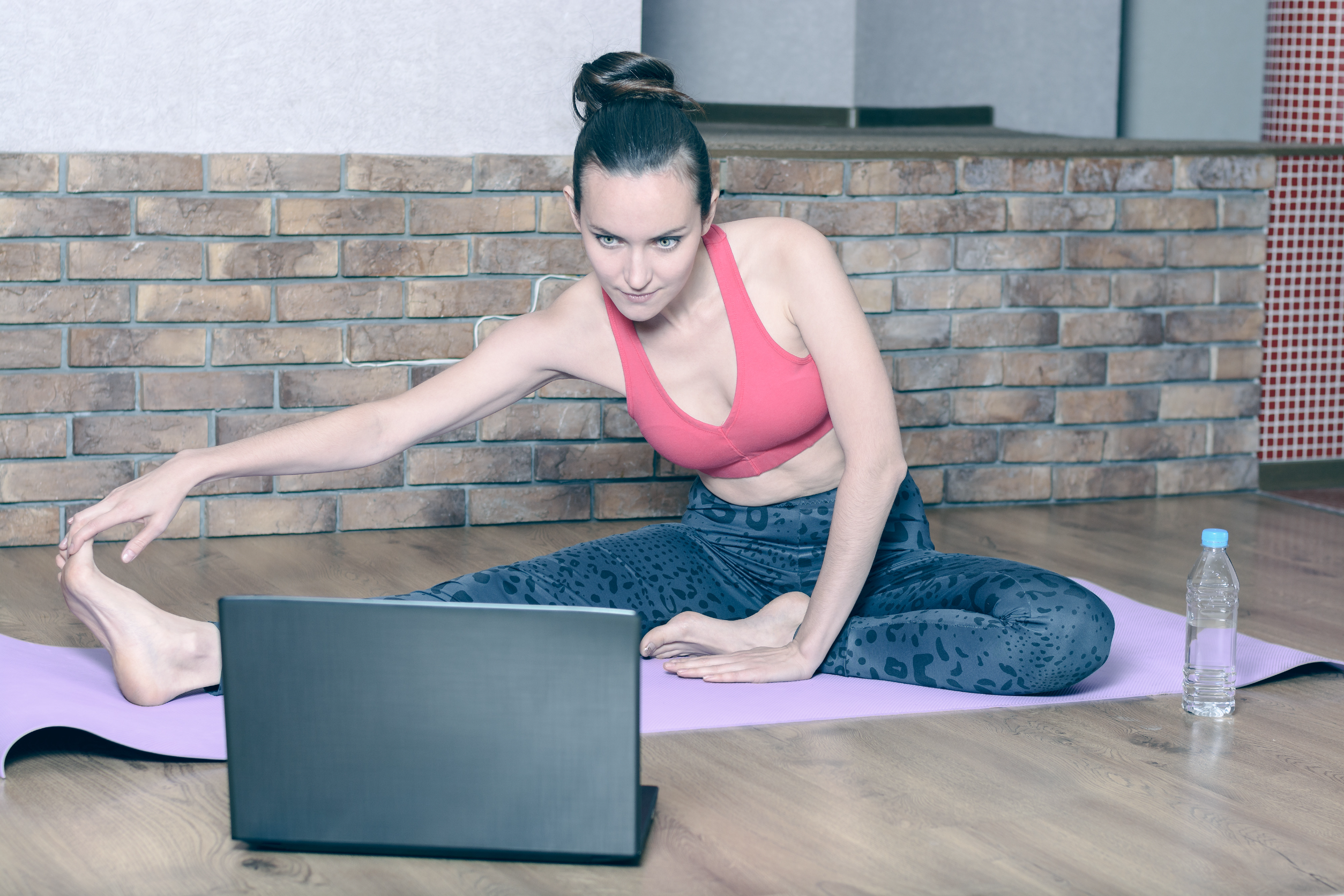lady stretching laptop
